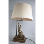 A Modern gilt Decorated Metal Novelty Table Lamp in the Form of Rabbit Sat Upon Three Books, With