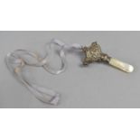 A Silver and Mother of Pearl Babies Combination Rattle and Teether, Boy Blue Embossed Decoration