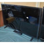 An LG 31" TV with Remote