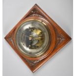 An Edwardian Carved Mahogany Framed Wall hanging Aneroid Barometer, Glass Cracked, 26cms Square