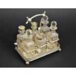 A Late 19th/Early 20th Century Silver Plated Six Bottle Cruet on rectangular Tray Base with