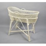 A Vintage Cream Painted Wicker Moses Basket and Stand, 87cms Wide