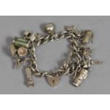 A Heavy Silver Charm Bracelet, London 1975, Consisting 13 Charms to include Carp, Welsh Dragon,