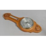 A Modern Carved Wooden Wheel Barometer/Thermometer, 49cms High