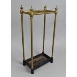 A Late Victorian/Edwardian Brass Six Division Stick Stand with Cast Iron Drip Tray, 31cms Wide and