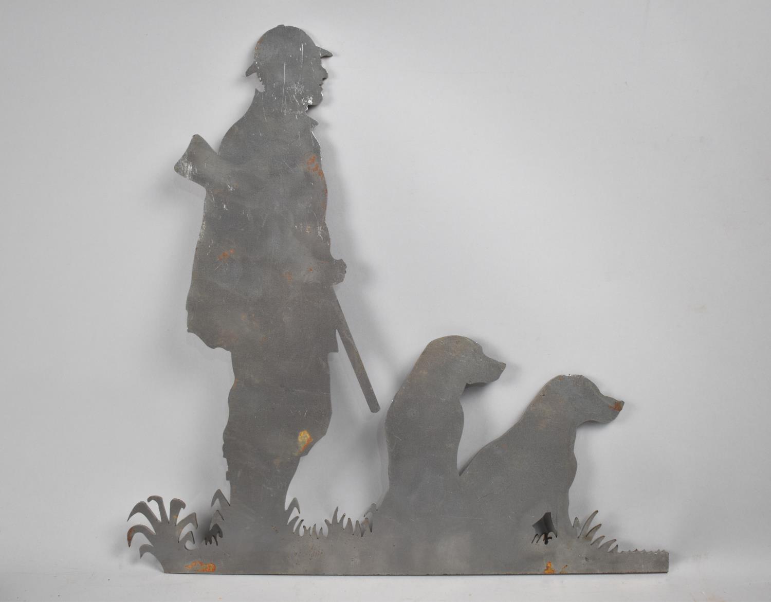 A Fret Cut Metal Decorative Piece for a Wind Vane in the Form of Sportsman with Two Gundogs, 35cms