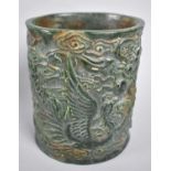 A Reproduction Chinese Green Hardstone Brush Pot Decorated with Dragons in Shallow Relief, 15cm high