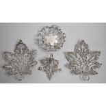 A Collection of Four White Metal Dishes in the Form of Leaves