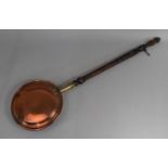 A Vintage Copper Bed Warming Pan with Turned wooden Handle