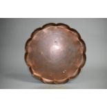 A Scalloped Edged Copper Dish with Art Nouveau Stylised Tulip Engraving, 24cms Diameter