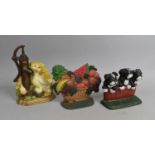 A Collection of Three Modern Coal Painted Cast Iron Door Stops