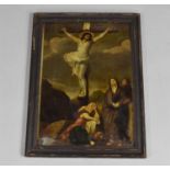 A 19th Century Reverse Painted Framed Glass Panel Depicting the Crucifixion of Christ, 25x35cms