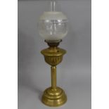 An Early 20th Century Brass Oil Lamp with ribbed Column Support, 70cms High Overall