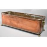 A Mid 20th Century Rectangular Copper Plant Trough with Brass Lion Maks and Ring Handles and Brass