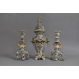 Three Pieces of Rouen Faience to Comprise Pair of Candlesticks and a Lidded Vase and Cover, Some