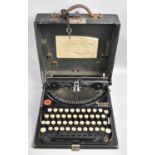 A Vintage Cased Remington Portable Manual Typewriter