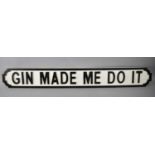 A Wooden Sign in the Form of a Cast Iron Road Sign, "Gin made me do it", 102cm wide