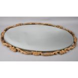 A Ornate Gilt Framed Oval Bevel Edge Wall Mirror, 67x39cm