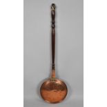 A Copper Bed Warming Pan with Turned Wooden Handle