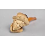 A Carved Meerschaum Pipe with Amber Mouthpiece, Bowl in the Form of Bearded African Gent with