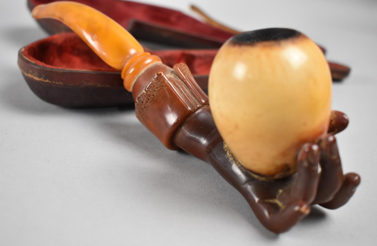 A 19th Century Cased Amber and Meerschaum Pipe Modelled as a Hand Holding an Egg, 21cms Long - Image 2 of 2