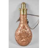 A Vintage Copper and Brass Shot Flask with Measuring Spout, Body Decorated in relief with Game