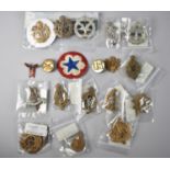 A Collection of Various Military Cap Badges to include American, Royal Flying Corps, Royal Engineers