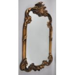 An Ornate Gilt Framed Wall Mirror, 75x42cm