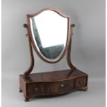 A Serpentine Front Mahogany Dressing Table Mirror with Shield Shaped Swing Glass and Three Drawers