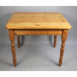 A Modern Rectangular Pine Effect Kitchen Table, 90cms by 76cms