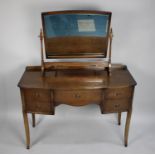 A Mid 20th Century Kneehole Dressing Table with Centre Drawer Flanked by Two Short Drawers Either