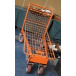 An Industrial Trolley with Sprung Bed and Small Top Shelf Mounted by Handlebar