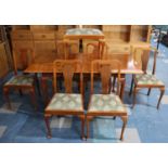 A Late 20th Century Extending Dining Table with Pad Feet Together with Matching Chairs having Vase