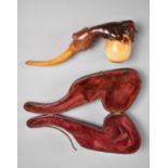 A 19th Century Cased Amber and Meerschaum Pipe Modelled as a Hand Holding an Egg, 21cms Long