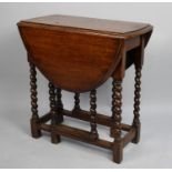 A Mid 20th Century Small Oak Drop Leaf Gate Leg Occasional Table with Barley Twist Supports, 51cms