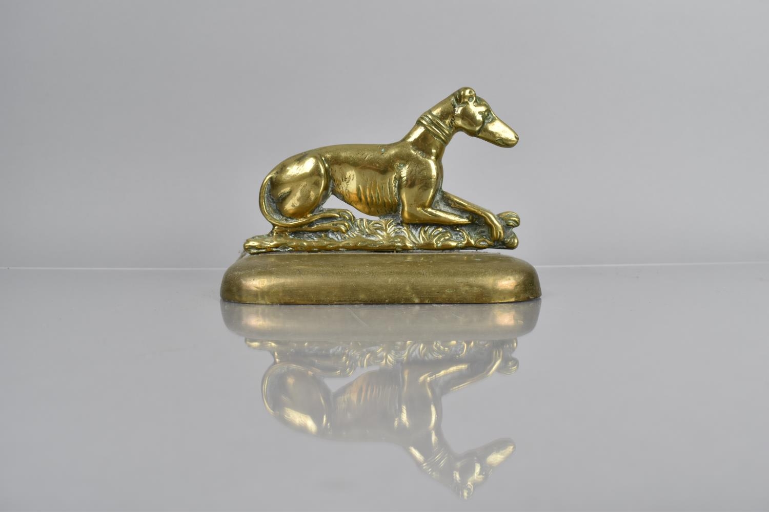 A 19th Century Brass Doorstop in the Form of a Recumbent Greyhound on Plinth, Weighted Base, 15cms