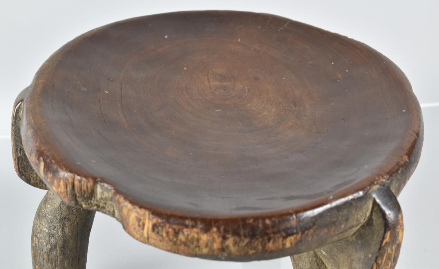 A Late 19th Century African Carved Wood He-He Stool from Tanzania, with a Well Patinated Dished - Image 4 of 7