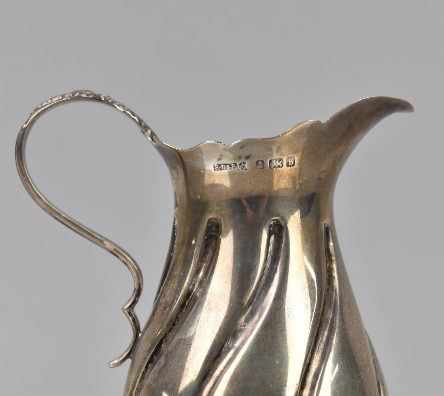 An Edward VII Silver Cream Jug of Wyrthen Form raised on Tripod Pad Feet with Scrolled Handle by - Image 2 of 2