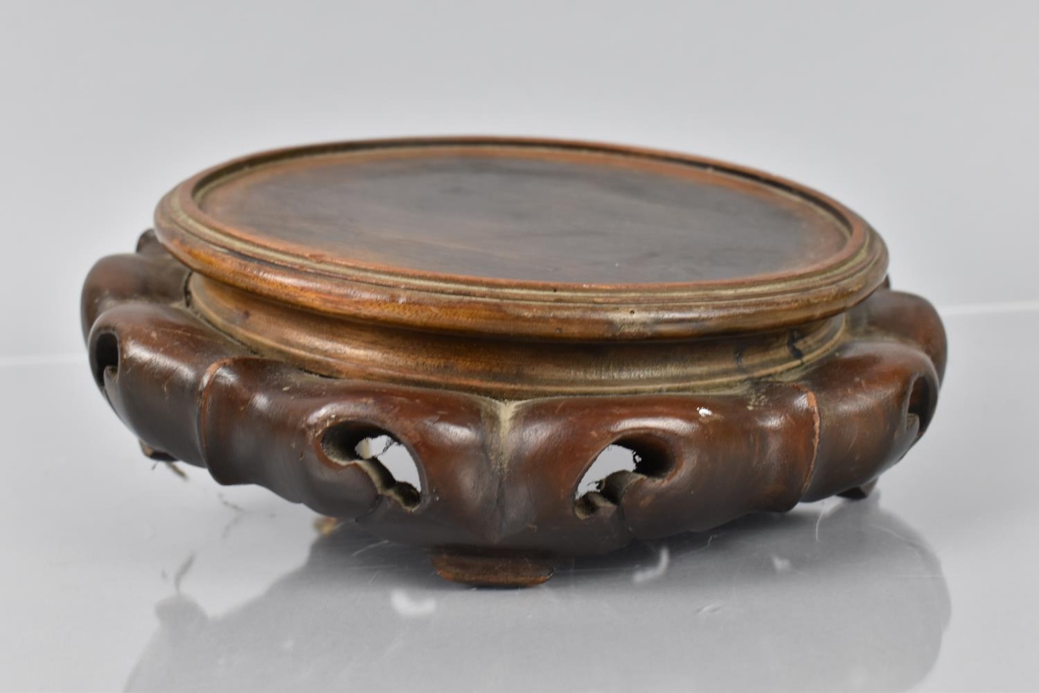 A 19th/20th Century Chinese Hardwood Stand of Circular Form with Pierced and Moulded Base, 22cms