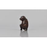 A 18th/19th Century Novelty Carved Coquilla Nut Snuff in the Form of a Gent Squatting, with Mother