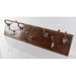 A Late 19th Century Country House Wall Mounted Coat Rack, The Hooks Mounted on a Carved Oak Panel,