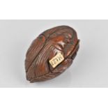 An 18th/19th Century Carved Coquilla Nut with Side Portrait Figural Design, 7cms