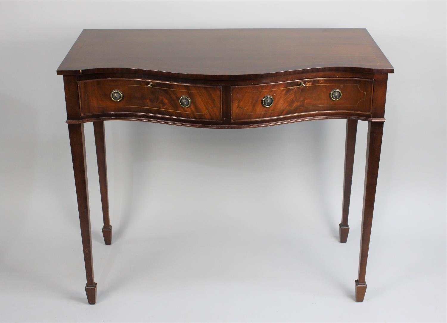 A Late 20th Century Mahogany Serpentine Front Side Table with Two Drawers on Tapering Square Legs