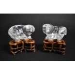A Pair of Chinese Rock Crystal Carvings in the Form of Temple Dogs on Carved and Pierced Wooden