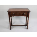 A Mid 20th Century Oak Side Table with Single Drawer having Carved Front, Turned Supports, 76cms