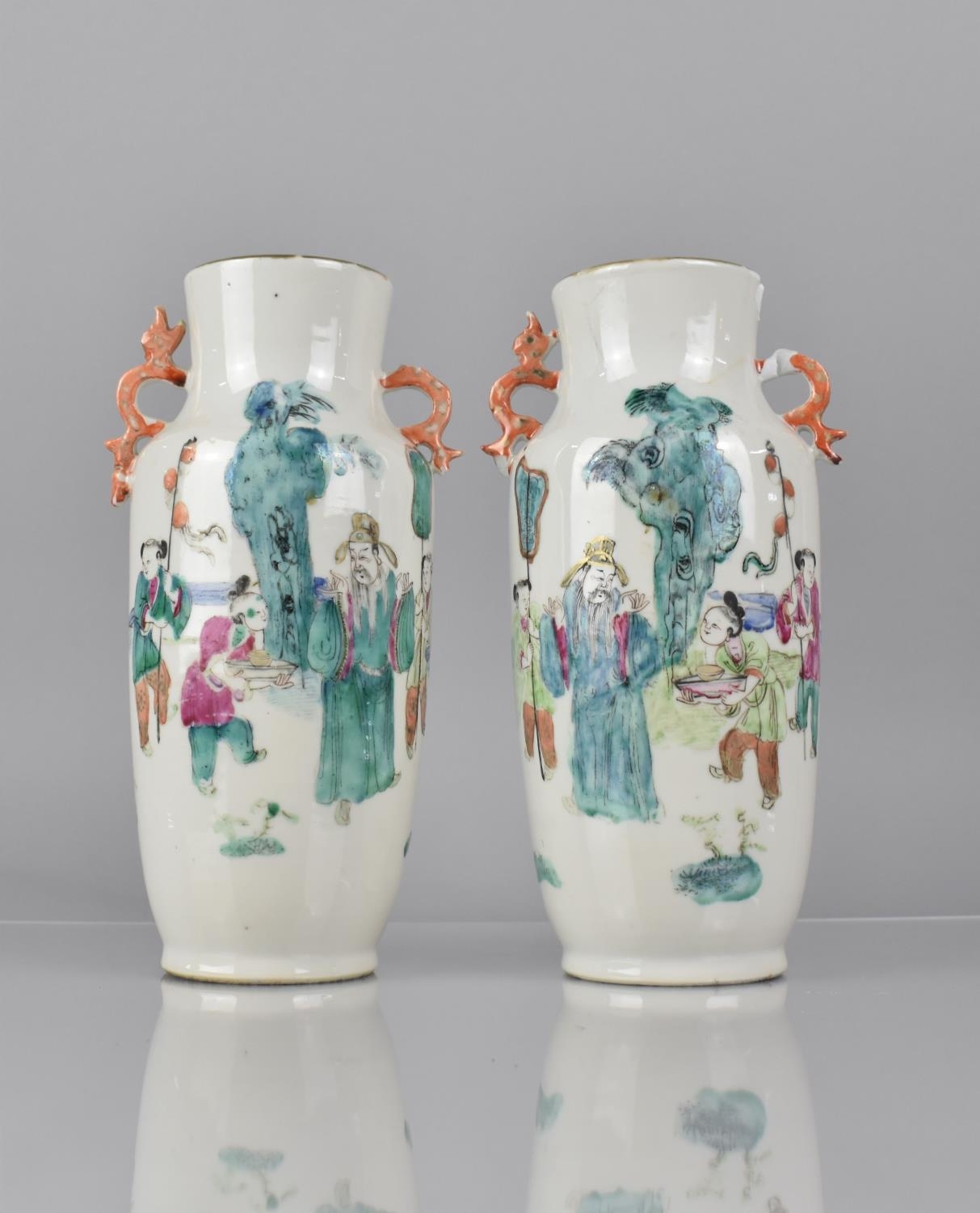 A Pair of 19th Century Chinese Porcelain Vases decorated in the Famille Rose Palette with Robed