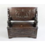 A Mid 20th Century Oak Monks Bench with Carved Lion Ends, 105cms Wide