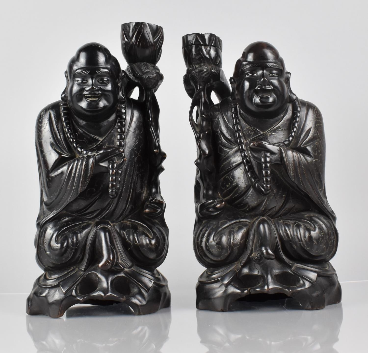 A Pair of Late 19th Century Chinese Hardwood Figural Candle Holders in the Form of Chinese Gods/