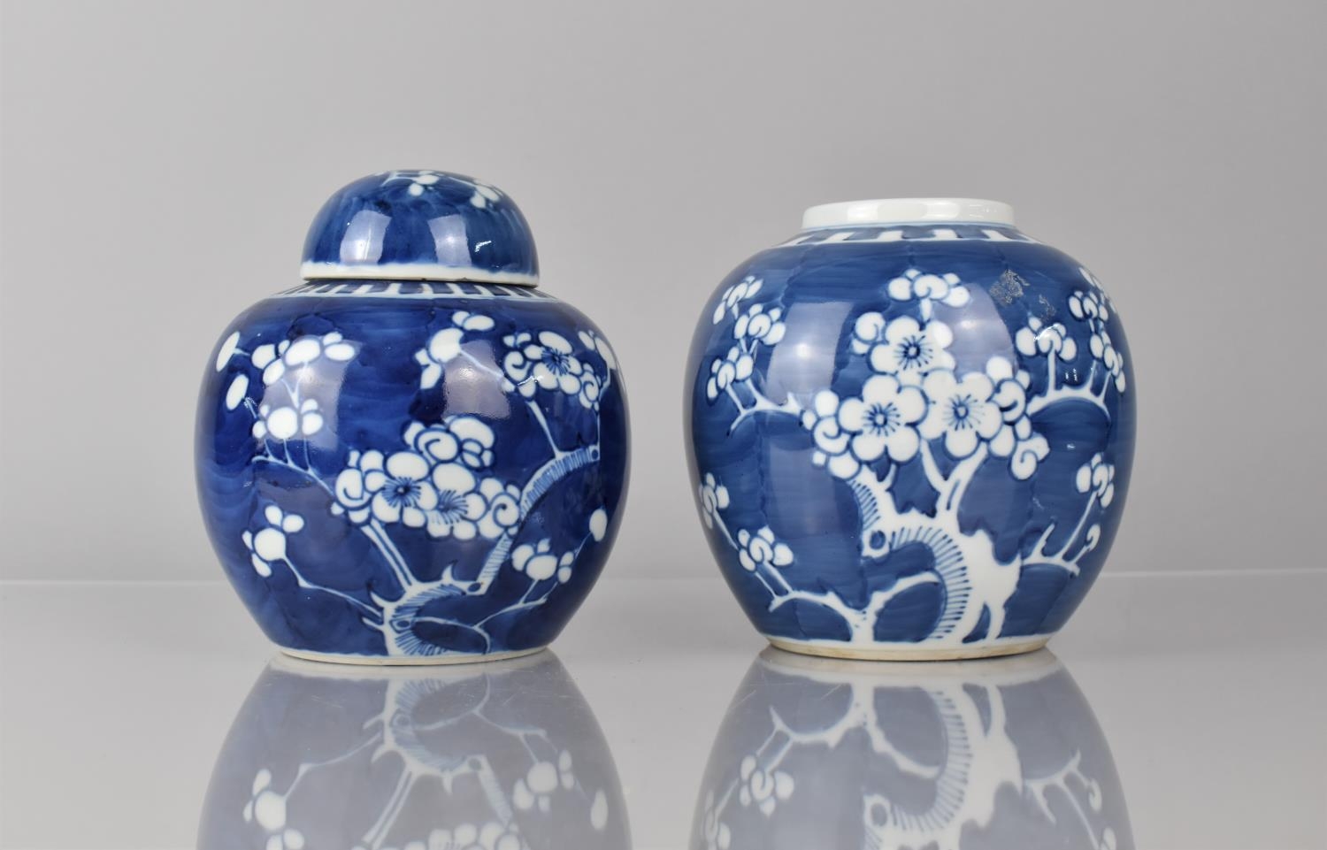 Two Chinese Porcelain Blue and White Prunus Pattern Ginger Jars, Both with Double Concentric Mark to