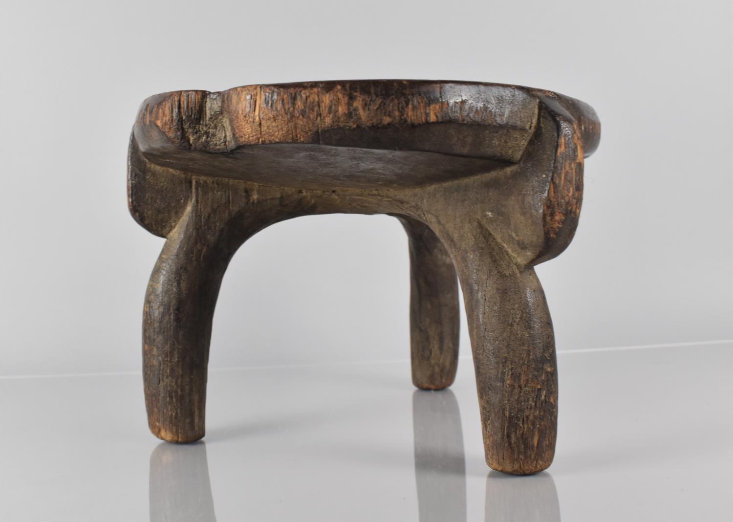 A Late 19th Century African Carved Wood He-He Stool from Tanzania, with a Well Patinated Dished